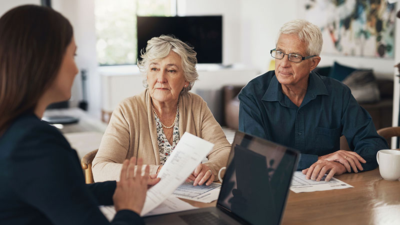 An elder couple talking with a CPA