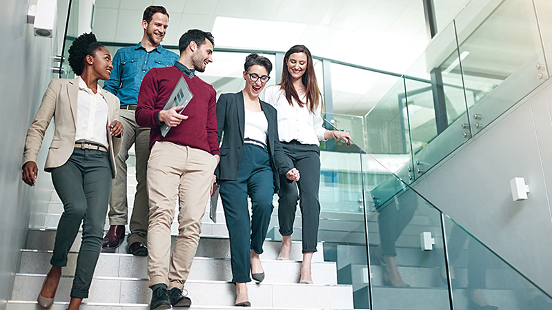 Colleagues walking through an office