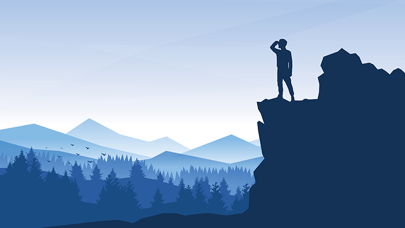 Man standing on the edge of a cliff