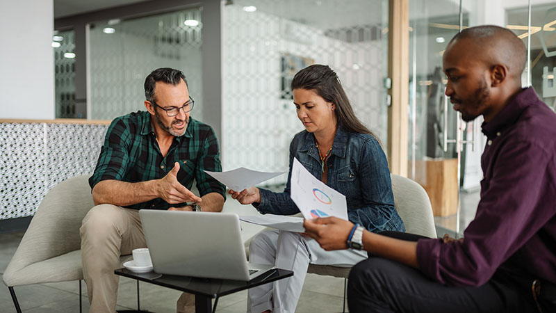 People sitting in an office looking at documents