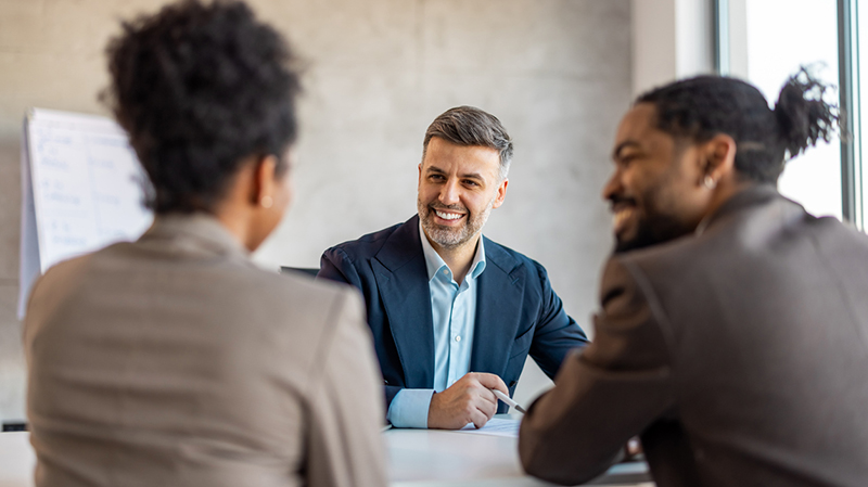 Three people having a meeting in an office