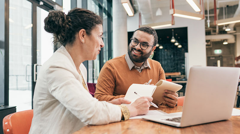 Two colleagues working together at the office
