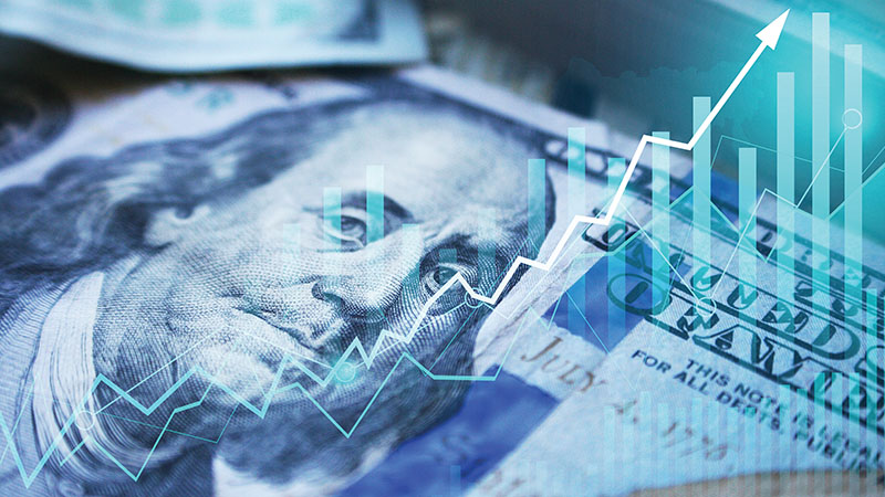 Dollar bill with a graph on top of it